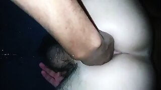 A large schlong and a hand inside a twink's ass